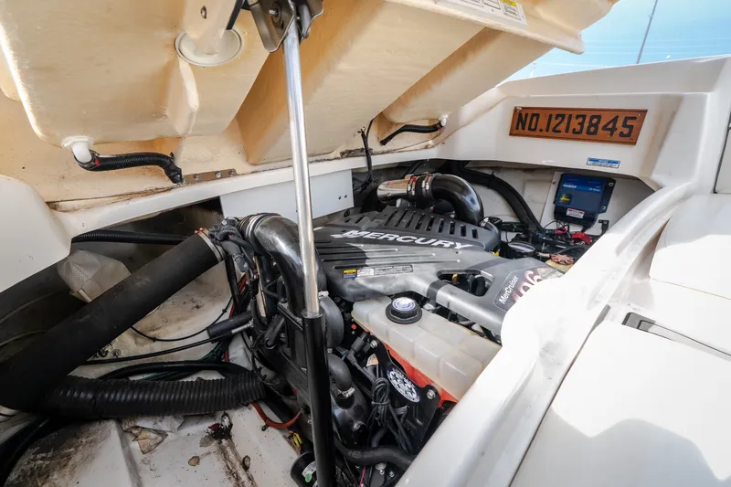 Slide: The Image of Engine compartment of a 2006 Sea Ray 270 SLX boat, featuring a Mercury engine. - 43