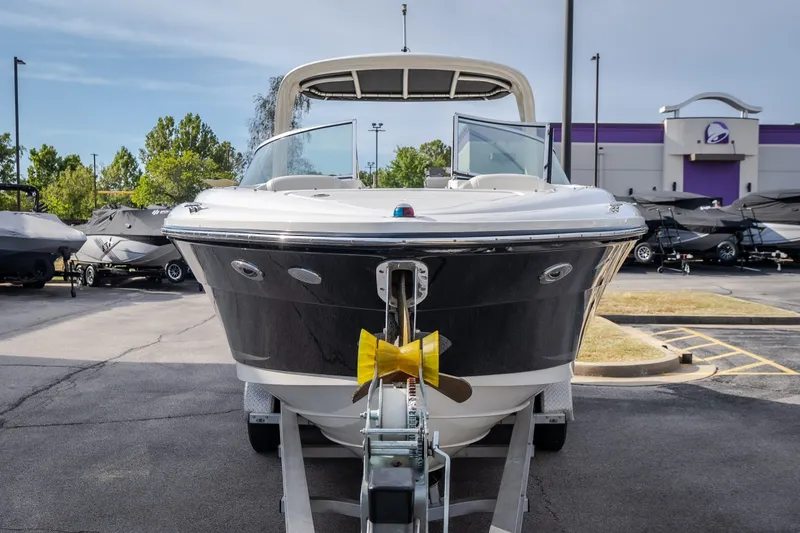 Slide: The Image of 2006 Sea Ray 270 SLX boat on trailer in outdoor dealership lot. - 5