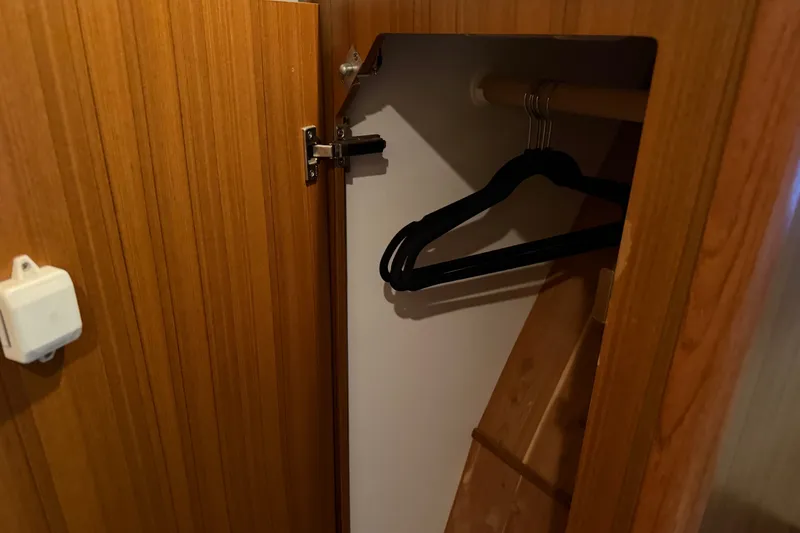 Slide: The Image of Wooden closet with hangers inside a 2001 Bayliner 3788 Command Bridge Motoryacht. - 41