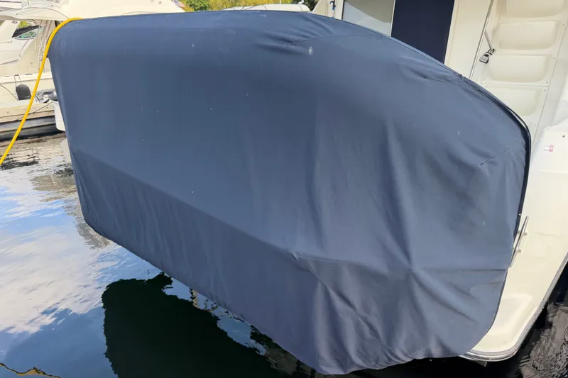 Slide: The Image of 2001 Bayliner 3788 Command Bridge Motoryacht with covered swim platform at dock. - 66
