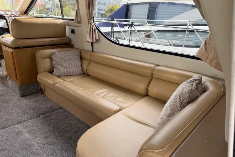 Slide: The Image of Interior of 2001 Bayliner 3788 Command Bridge Motoryacht with beige leather seating. - 6