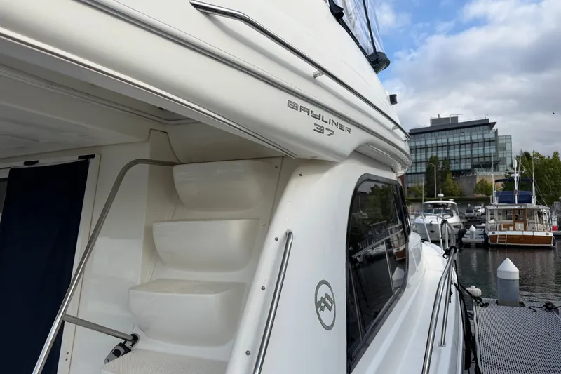 Slide: The Image of 2001 Bayliner 3788 Command Bridge Motoryacht docked at marina, side view. - 69
