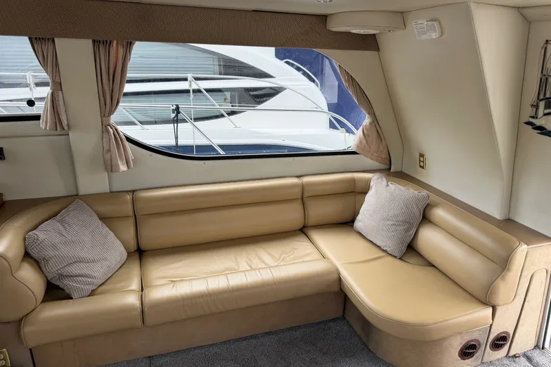 Slide: The Image of Interior of 2001 Bayliner 3788 Command Bridge Motoryacht with beige leather seating. - 7