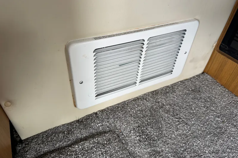 Slide: The Image of Vent on 2001 Bayliner 3788 Command Bridge Motoryacht, installed on carpeted interior wall. - 62