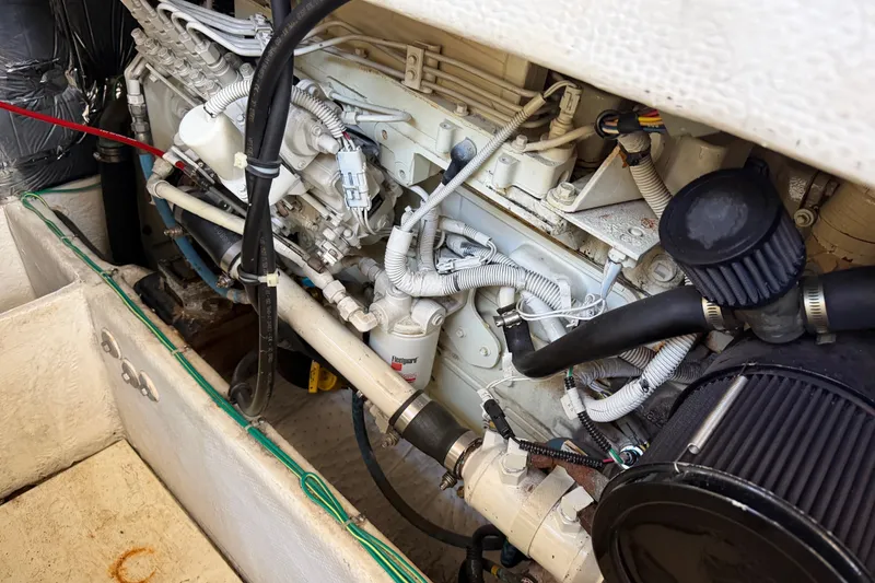 Slide: The Image of Engine compartment of a 2001 Bayliner 3788 Command Bridge Motoryacht, showcasing detailed components. - 56