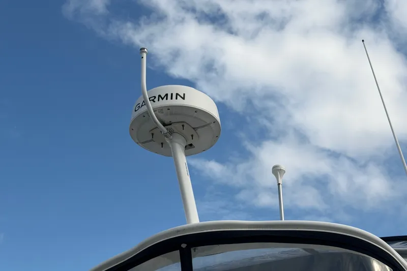 Slide: The Image of Garmin radar on 2001 Bayliner 3788 Command Bridge Motoryacht against blue sky. - 73