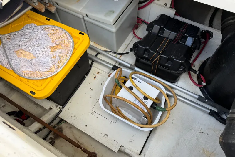Slide: The Image of Storage compartment of 2001 Bayliner 3788 Command Bridge Motoryacht with equipment and cables. - 59