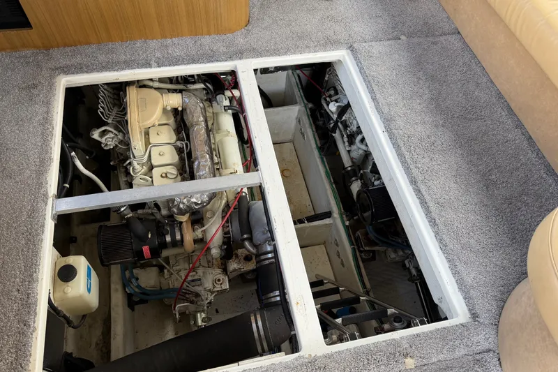 Slide: The Image of Engine compartment of a 2001 Bayliner 3788 Command Bridge Motoryacht, showcasing mechanical components. - 53