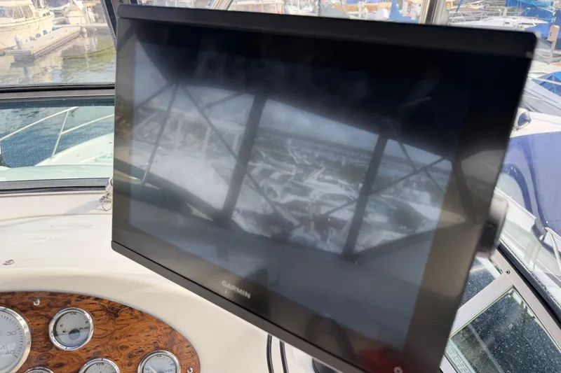 Slide: The Image of Dashboard of 2001 Bayliner 3788 Command Bridge Motoryacht with Garmin display. - 48