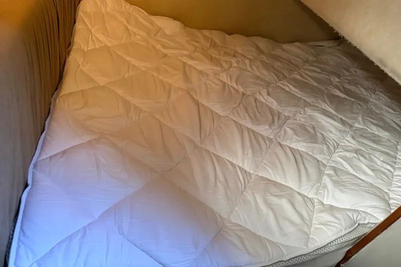 Slide: The Image of Cozy sleeping area in 2001 Bayliner 3788 Command Bridge Motoryacht with white bedding. - 39