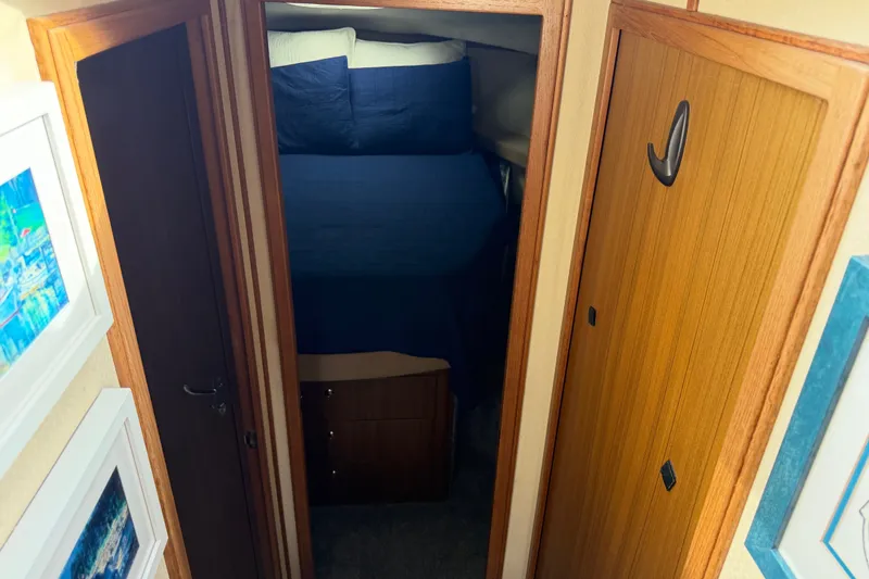 Slide: The Image of Interior hallway of 2001 Bayliner 3788 Command Bridge Motoryacht with wood paneling and artwork. - 23