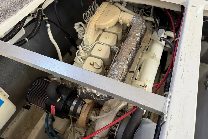 Slide: The Image of Engine compartment of a 2001 Bayliner 3788 Command Bridge Motoryacht, showcasing mechanical components. - 55