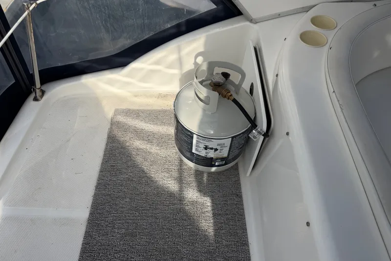 Slide: The Image of Propane tank on Bayliner 3788 Command Bridge Motoryacht, 2001 model, with carpeted deck. - 51