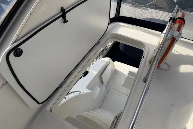 Slide: The Image of 2001 Bayliner 3788 Command Bridge Motoryacht interior hatch with stairs and life preserver. - 52