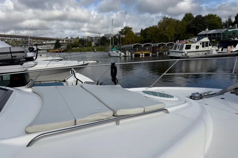 Slide: The Image of 2001 Bayliner 3788 Command Bridge Motoryacht docked in a scenic marina. - 71