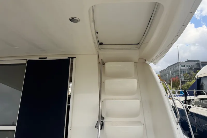 Slide: The Image of 2001 Bayliner 3788 Command Bridge Motoryacht, showing stairs and partial deck view. - 43