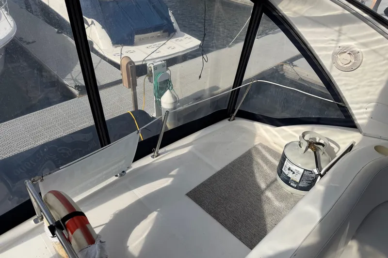 Slide: The Image of 2001 Bayliner 3788 Command Bridge Motoryacht interior with propane tank and marina view. - 50