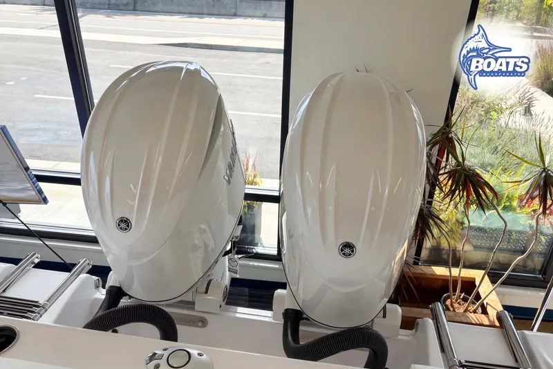 Slide: The Image of Twin Yamaha outboard engines on a 2027 Sportsman Heritage 261 Center Console boat. - 11