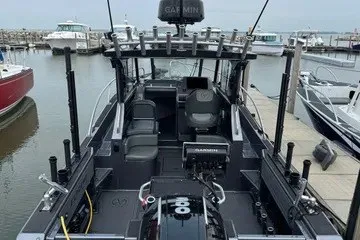 The Image of 2022 Extreme 745 WA boat docked, featuring advanced navigation equipment and spacious seating. - 1