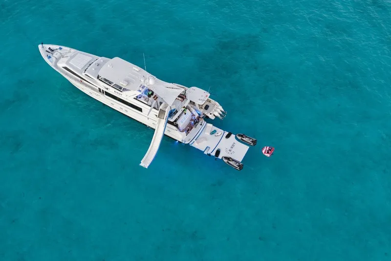 The Image of Aerial view of 2004 Broward 110 yacht on clear turquoise water. - 1
