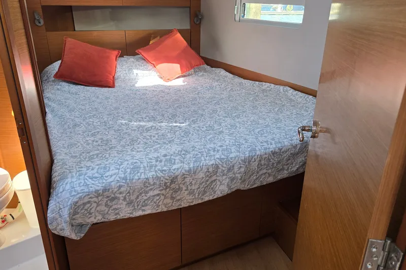 Slide: The Image of Cozy cabin interior of 2020 Jeanneau Sun Odyssey 410 with bed and pillows. - 39