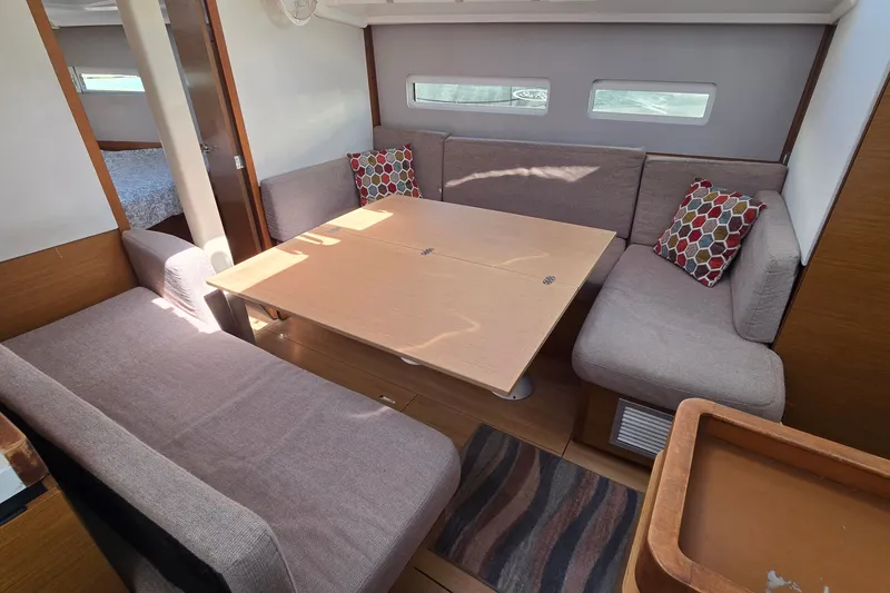 Slide: The Image of Interior of 2020 Jeanneau Sun Odyssey 410 yacht with cozy seating and dining area. - 37