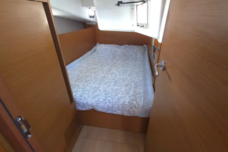 Slide: The Image of Cozy cabin interior of 2020 Jeanneau Sun Odyssey 410 sailboat with a comfortable bed. - 44