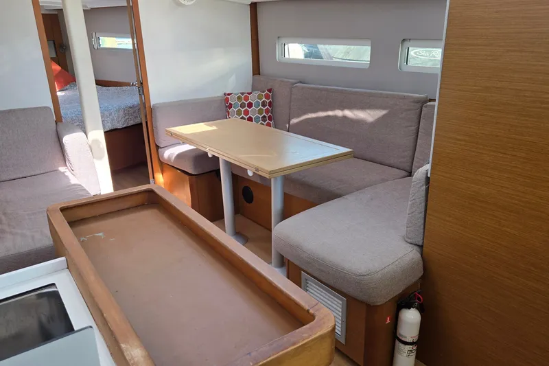 Slide: The Image of Interior of 2020 Jeanneau Sun Odyssey 410 yacht with cozy seating and table. - 31