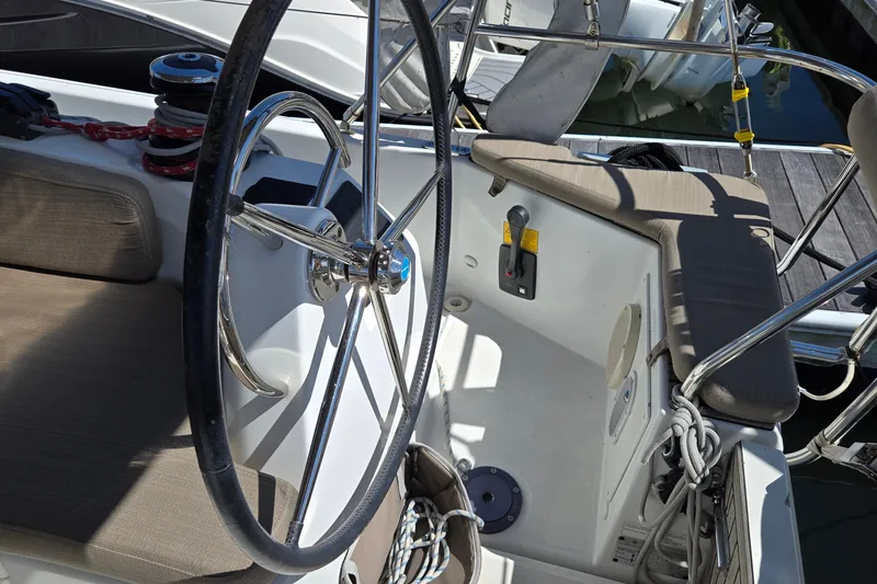 Slide: The Image of Cockpit of 2020 Jeanneau Sun Odyssey 410 sailboat with steering wheel and seating. - 14