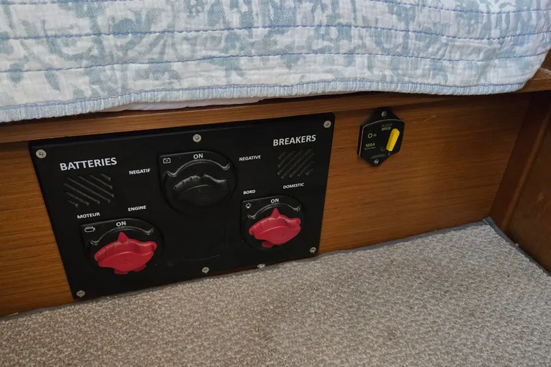 Slide: The Image of Battery and breaker panel on 2020 Jeanneau Sun Odyssey 410 sailboat interior. - 56