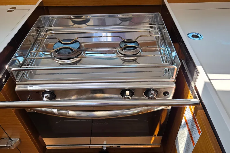 Slide: The Image of Stainless steel stove in Jeanneau Sun Odyssey 410 yacht kitchen, 2020 model. - 54
