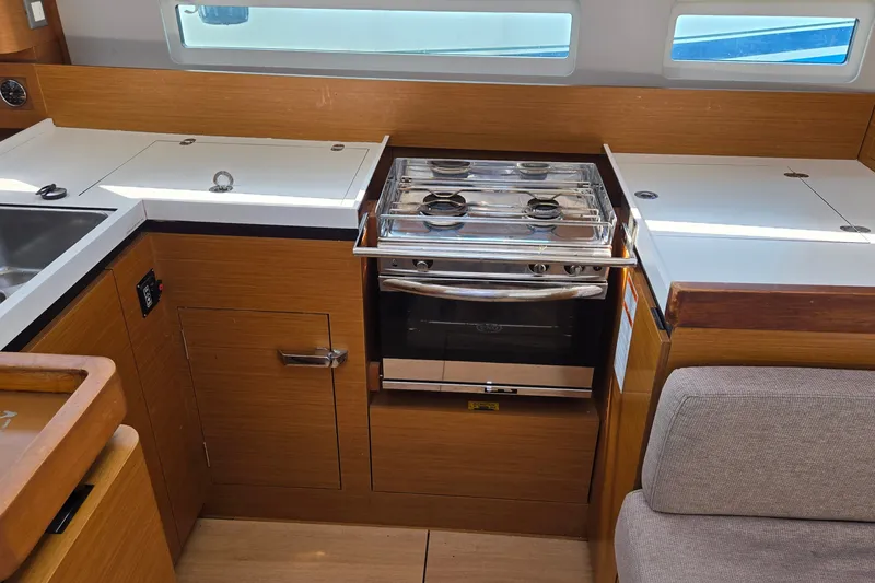 Slide: The Image of Modern kitchen area in a 2020 Jeanneau Sun Odyssey 410 sailboat. - 34