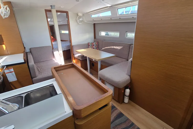 Slide: The Image of Interior of 2020 Jeanneau Sun Odyssey 410 yacht, featuring cozy seating and modern design. - 30