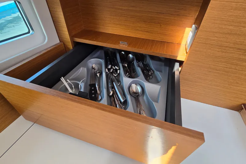 Slide: The Image of Cutlery drawer in Jeanneau Sun Odyssey 410 yacht, 2020 model, with organized utensils. - 48