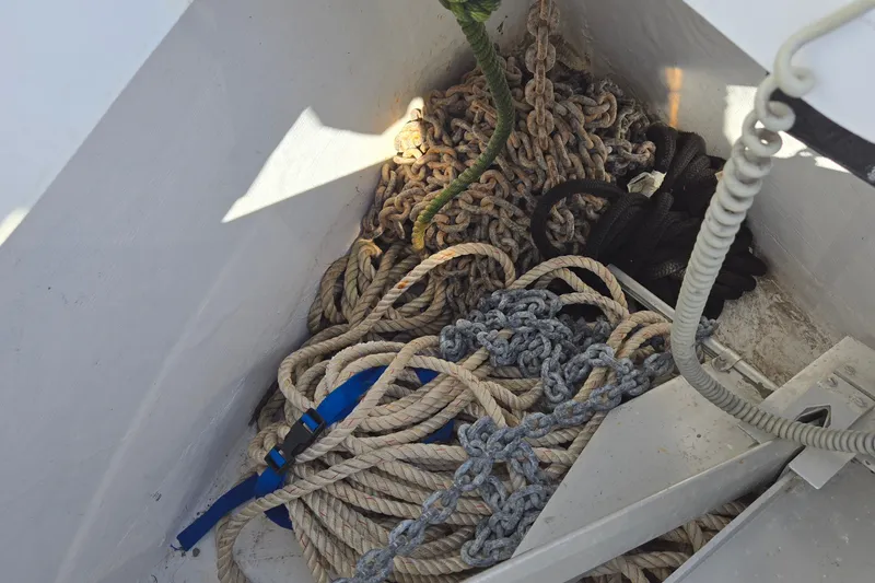 Slide: The Image of Ropes and chains in the anchor locker of a 2020 Jeanneau Sun Odyssey 410 sailboat. - 20