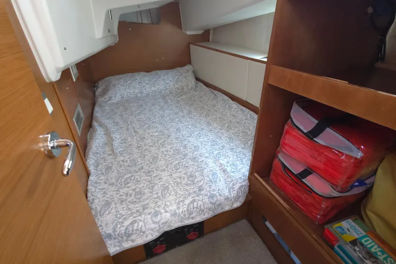 Slide: The Image of Cozy cabin interior of 2020 Jeanneau Sun Odyssey 410 sailboat with bed and storage. - 43