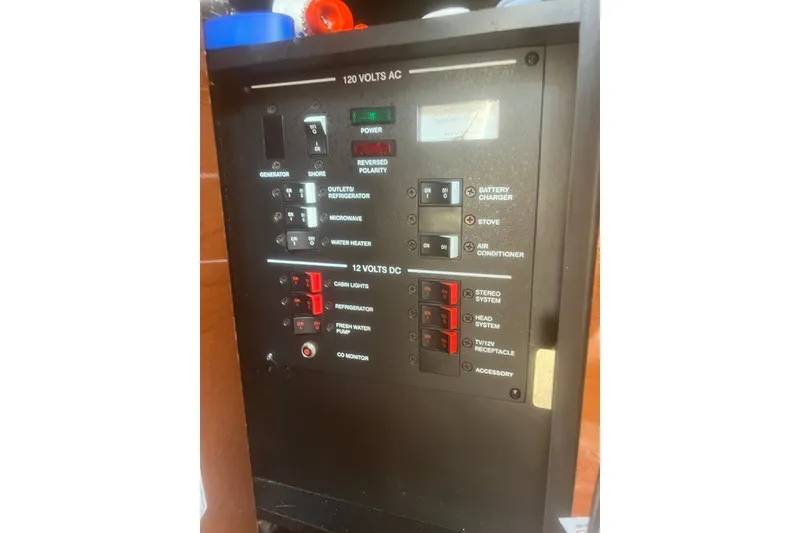 Slide: The Image of Electrical control panel on a 2008 Sea Ray 220 Sundancer boat. - 26