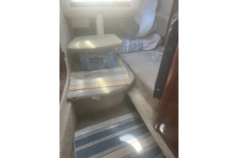 Slide: The Image of Interior of 2008 Sea Ray 220 Sundancer with seating and storage area. - 23