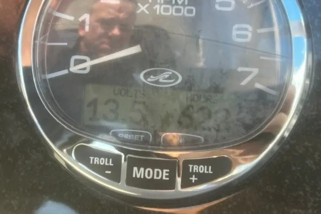 Slide: The Image of Close-up of a 2008 Sea Ray 220 Sundancer tachometer displaying RPM and hours. - 13