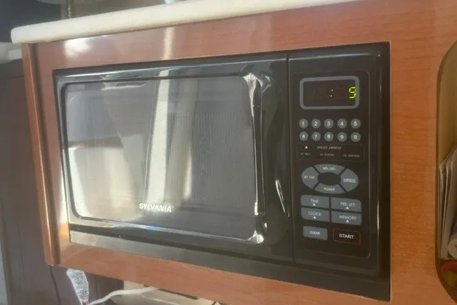 Slide: The Image of Sylvania microwave in 2008 Sea Ray 220 Sundancer boat kitchen. - 21