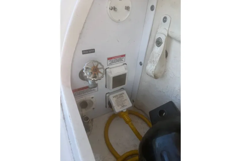 Slide: The Image of Electrical and water connections on a 2008 Sea Ray 220 Sundancer boat. - 31