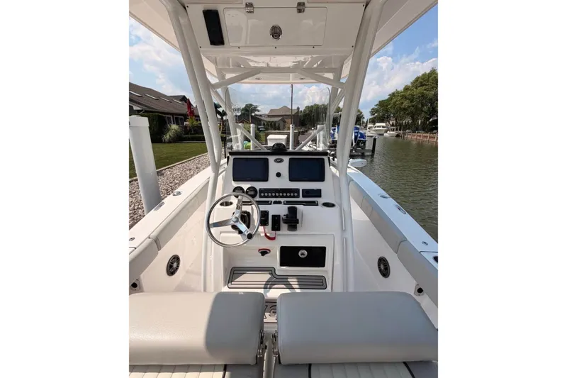 Slide: The Image of 2023 Sea Fox 248 Commander boat interior with steering wheel and control panel. - 9