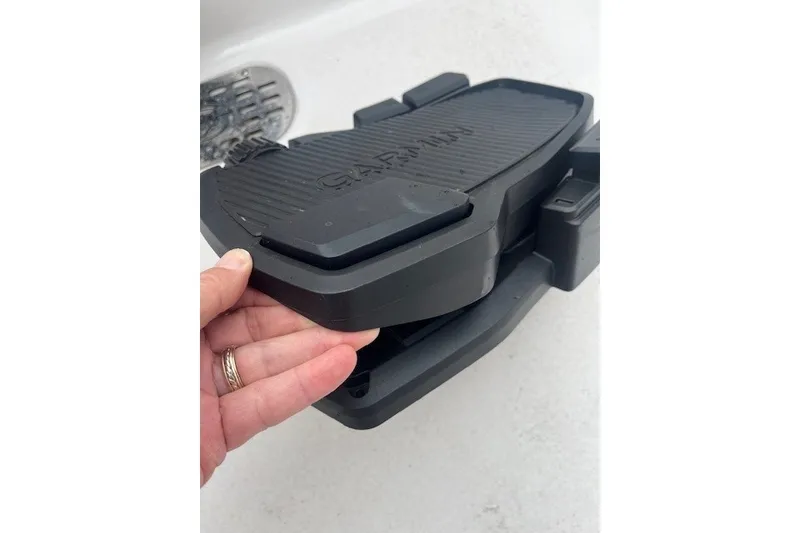 Slide: The Image of Hand adjusting Garmin device on 2023 Sea Fox 248 Commander boat. - 29