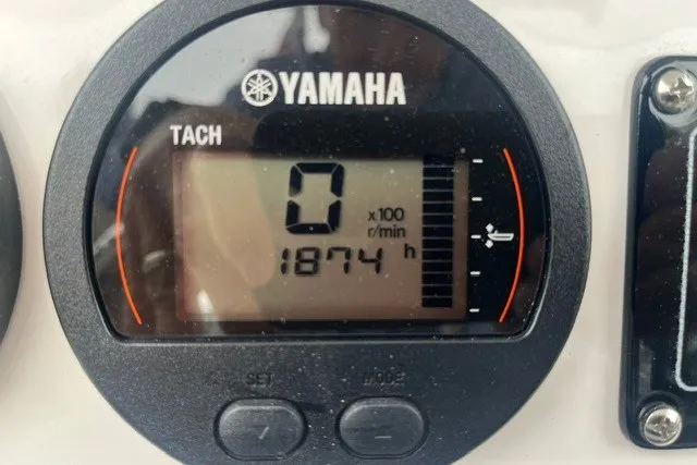 Slide: The Image of Yamaha tachometer displaying 1874 hours on a 2023 Sea Fox 248 Commander boat. - 15