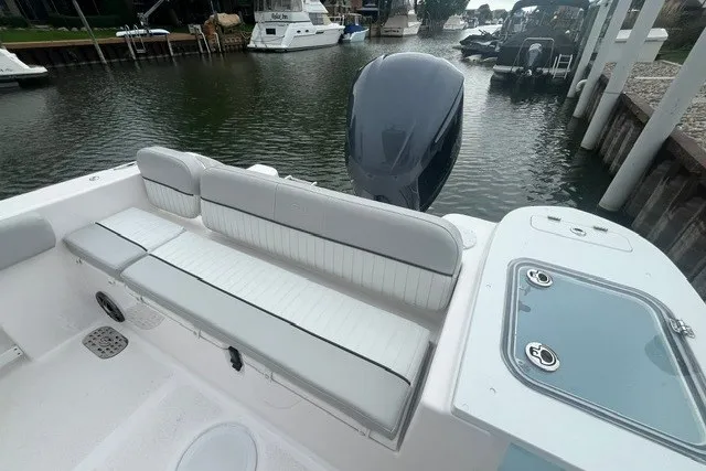 Slide: The Image of 2023 Sea Fox 248 Commander boat with seating and motor, docked in a marina. - 24