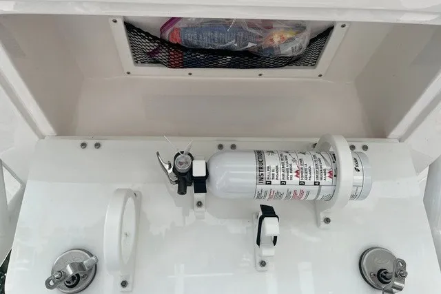 Slide: The Image of 2023 Sea Fox 248 Commander boat console with fire extinguisher and storage compartment. - 33