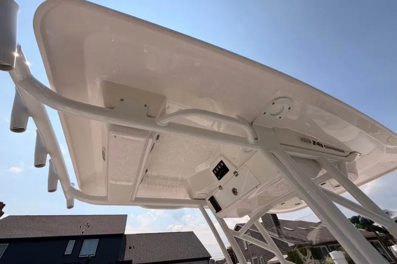 Slide: The Image of 2023 Sea Fox 248 Commander boat's T-top structure under a clear blue sky. - 20