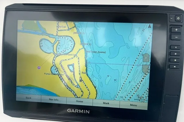Slide: The Image of Garmin navigation display on 2023 Sea Fox 248 Commander boat, showing detailed marine map. - 12