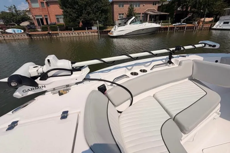 Slide: The Image of 2023 Sea Fox 248 Commander boat with Garmin equipment, docked near waterfront homes. - 18