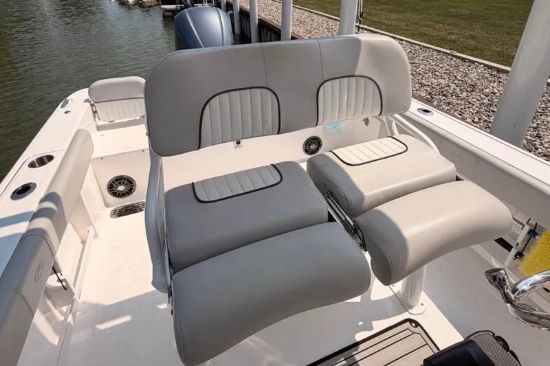 Slide: The Image of 2023 Sea Fox 248 Commander boat interior with cushioned seating and sleek design. - 19